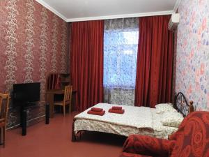 Postel nebo postele na pokoji v ubytování Voskhod Hotel
