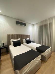 Ένα ή περισσότερα κρεβάτια σε δωμάτιο στο Villa Firdaous