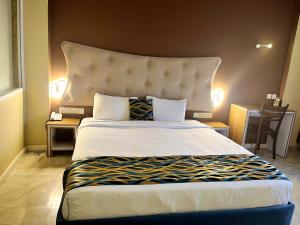 Postel nebo postele na pokoji v ubytování Aryana Queen Beach Resort