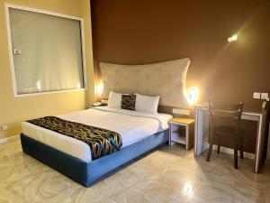 Postel nebo postele na pokoji v ubytování Aryana Queen Beach Resort