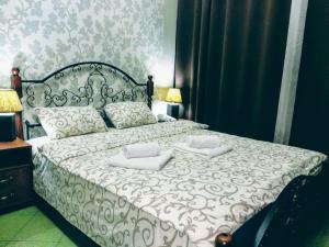 Postel nebo postele na pokoji v ubytování Voskhod Hotel