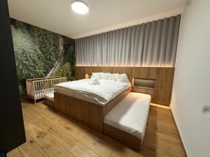 A bed or beds in a room at Villa Erdődy Resort