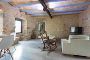 AS Palau dels Alemanys Suites Boutique Monument的电视和/或娱乐中心