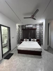 Postel nebo postele na pokoji v ubytování Hotel Simony Palace