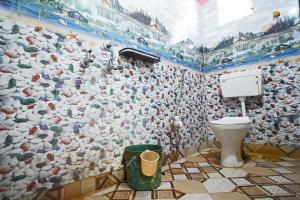 a bathroom with a flock of chickens mural on the wall at Gouranga Guest House Mayapur ISKCON 300 MTS in mayapur +37 photos