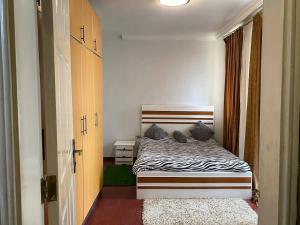 Ένα ή περισσότερα κρεβάτια σε δωμάτιο στο Comfortable & Affordable family stay in Addis