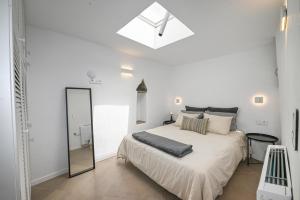 En eller flere senge i et værelse på Stone Grey Arnados