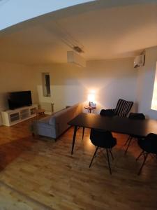 a living room with a couch and a table at 3 rum och kök 3 bäddar in Ruda +5 photos