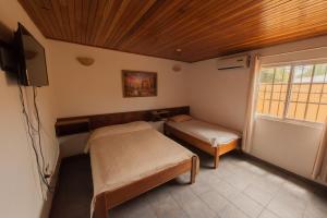 Letto o letti in una camera di Hotel Posada Los Delfines