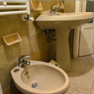 a bathroom with a toilet and a sink at by Domy in Ostuni +26 photos