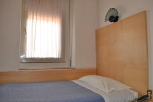 Postel nebo postele na pokoji v ubytování Hotel Igea