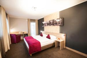 Postel nebo postele na pokoji v ubytování Amalienburg - Boutique & Boarding Hotel