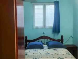Postel nebo postele na pokoji v ubytování Maison accueillant jusqu'à 7 personnes à Basse-Terre