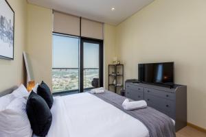Postel nebo postele na pokoji v ubytování Modern 1BR Apartment, High Floor, Near Dubai Mall + 28 fotografií