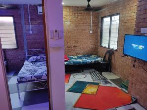 Posezení v ubytování Roomstay Nurfadz Sg Buloh + 3 fotografie