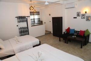 Postelja oz. postelje v sobi nastanitve Go Yala Hostel