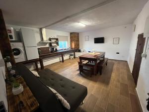 a living room with a couch and a table at El Lagar de Enzo in Icod de los Vinos