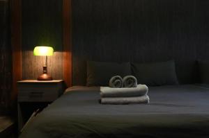 Postel nebo postele na pokoji v ubytování Wonderlust Inn