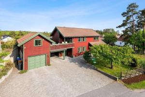 an overhead view of a red house with a garage at La Casa Roja in Sandefjord