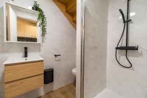 a bathroom with a shower and a sink and a toilet at NEW Le Turquoise au coeur de Guingamp Parking in Guingamp +9 photos