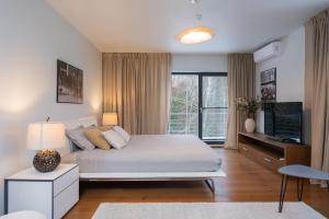 Postel nebo postele na pokoji v ubytování Villa Saskia