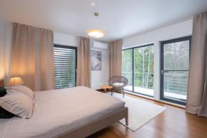 Postel nebo postele na pokoji v ubytování Villa Saskia