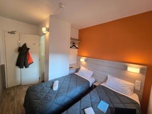 Postel nebo postele na pokoji v ubytování Premiere Classe Lyon Beynost