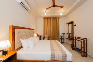 Postel nebo postele na pokoji v ubytování Ivory Resort Dikwella + 37 fotografií