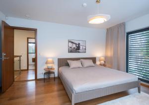 Postel nebo postele na pokoji v ubytování Villa Saskia