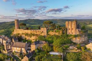 an aerial view of an old castle in a village at La Marie-Louise in Brive-la-Gaillarde