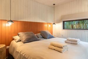 Voodi või voodid majutusasutuse Carintia Cabins toas