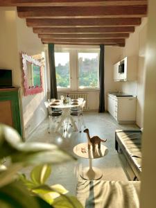 a living room with a dog figurine on a table at Casa sulle mura Romane - Old town in Bergamo