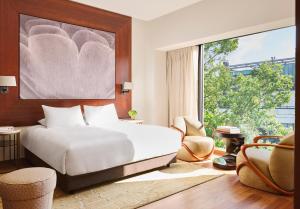 A bed or beds in a room at Park Hyatt Zurich – City Center Luxury