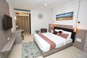 Postel nebo postele na pokoji v ubytování Le Prestige Residency