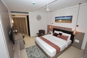 Postel nebo postele na pokoji v ubytování Le Prestige Residency