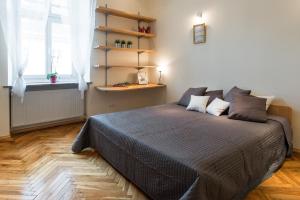 Posteľ alebo postele v izbe v ubytovaní Urban Studio Apartment