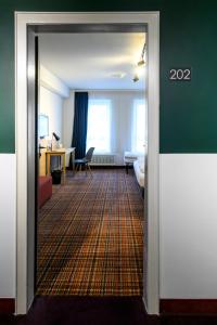 Postel nebo postele na pokoji v ubytování Hotel Ambassador Essen