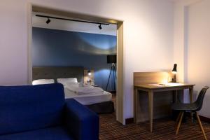 Postel nebo postele na pokoji v ubytování Hotel Ambassador Essen