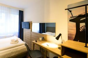 Postel nebo postele na pokoji v ubytování Hotel Ambassador Essen