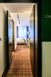 Postel nebo postele na pokoji v ubytování Hotel Ambassador Essen