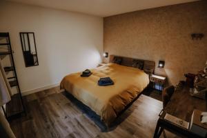 Ein Bett oder Betten in einem Zimmer der Unterkunft Maison Ubuntu
