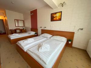 Postel nebo postele na pokoji v ubytování König Hotel