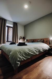 Ein Bett oder Betten in einem Zimmer der Unterkunft Maison Ubuntu