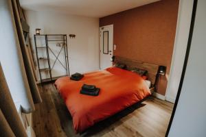 Ein Bett oder Betten in einem Zimmer der Unterkunft Maison Ubuntu