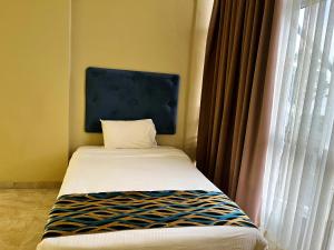 Postel nebo postele na pokoji v ubytování Aryana Queen Beach Resort