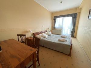 Postel nebo postele na pokoji v ubytování König Hotel