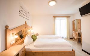 Postel nebo postele na pokoji v ubytování Boutique Pension Erlacher - Adults Only