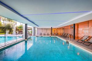 an indoor swimming pool with a view of a building at Barceló Sevilla Renacimiento in Seville