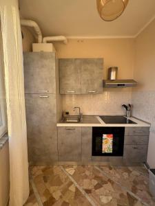 a small kitchen with a sink and a stove at Sally's - Nel cuore di Sanremo in Sanremo