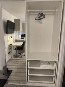 an open closet with a desk in an office at Crown's Court in Orpington